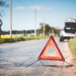 red-warning-triangle-and-broken-car-at-the-side-of-the-road-picjumbo-com