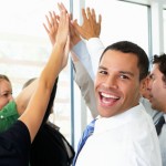 Business Team Giving One Another High Five